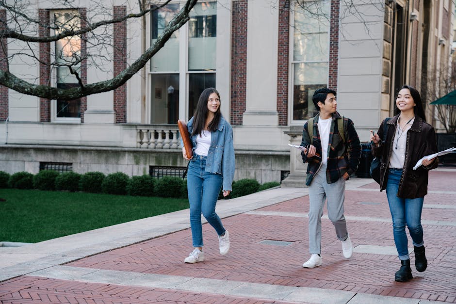Group of young students walking on campu