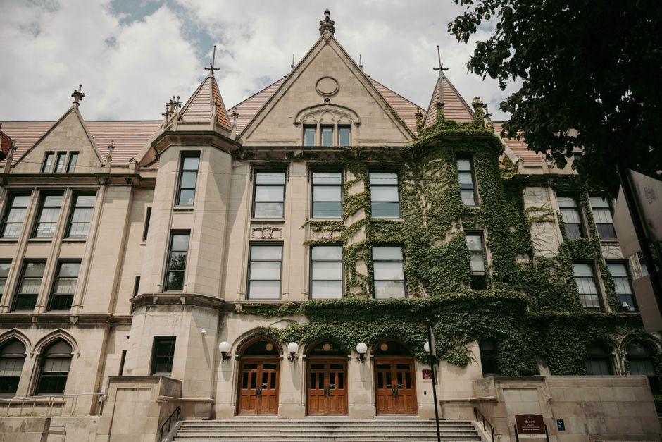 Ivy-covered historic building facade wit