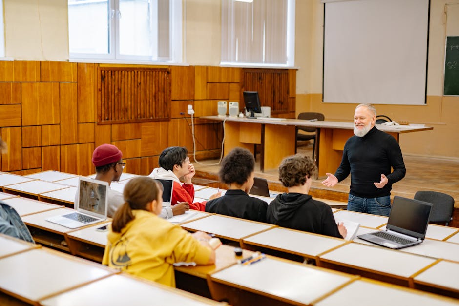 Students engaging with a professor in a 