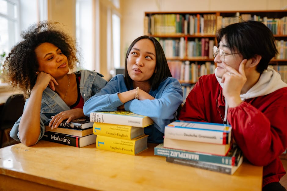 Three diverse students studying together