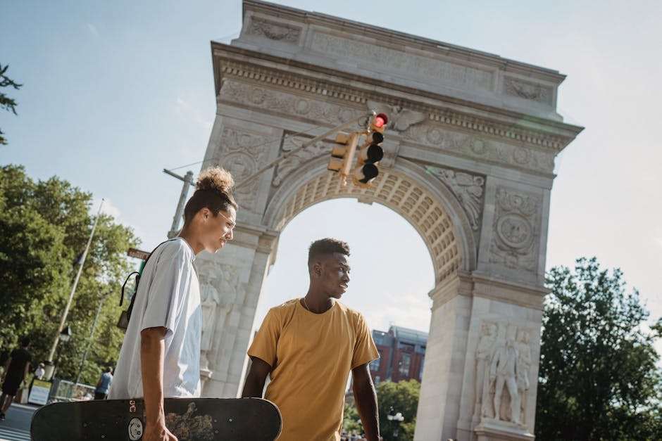 From below of multiethnic male skateboar