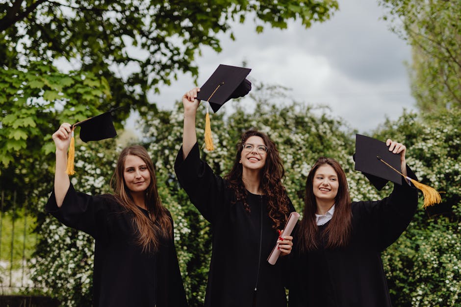 Three young women celebrating their grad