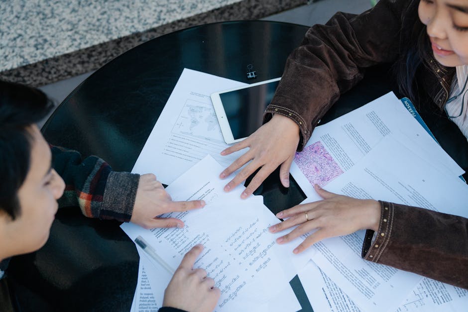Two students discuss and study together 