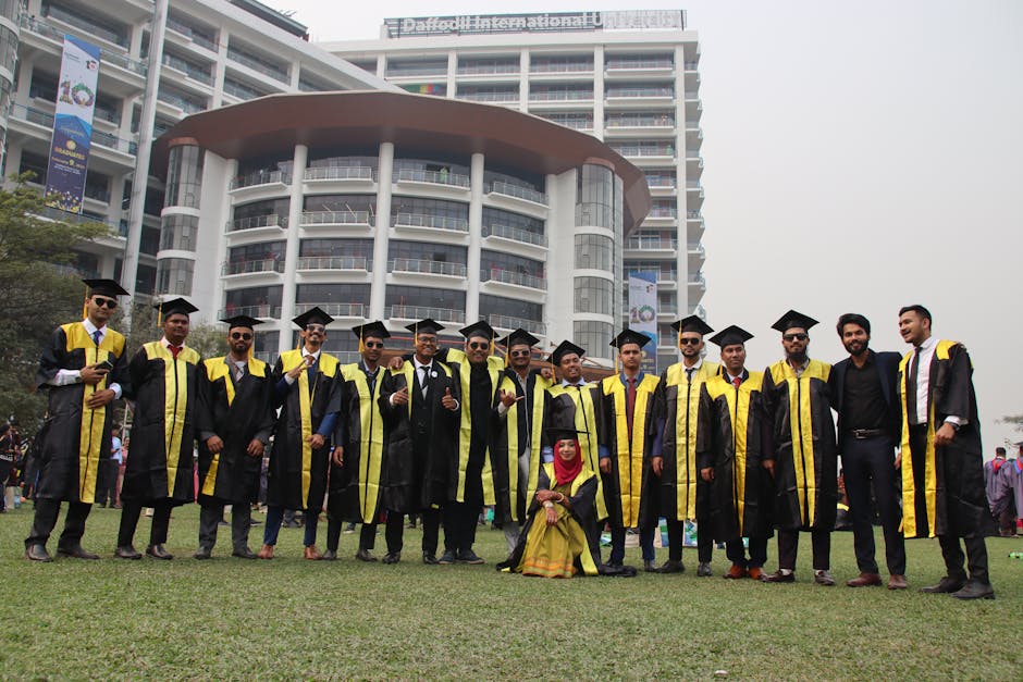 Graduates in caps and gowns gather for a